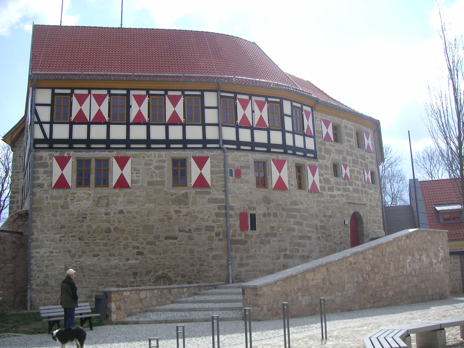 Scharfenstein Castle with characteristic half-timbering and heraldic shutters