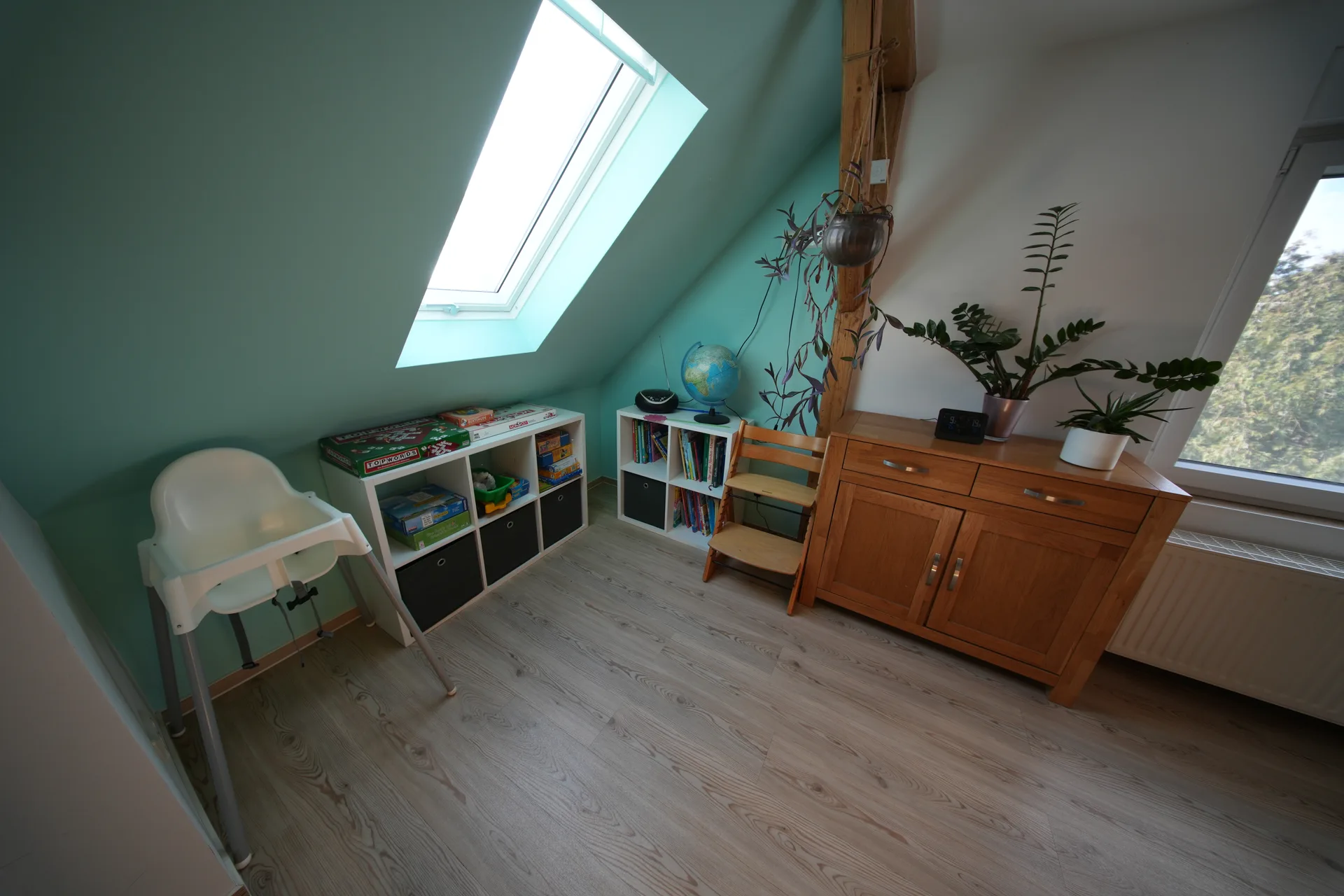 Schöne Aussicht – Children's room with play area, high chair and toy shelves