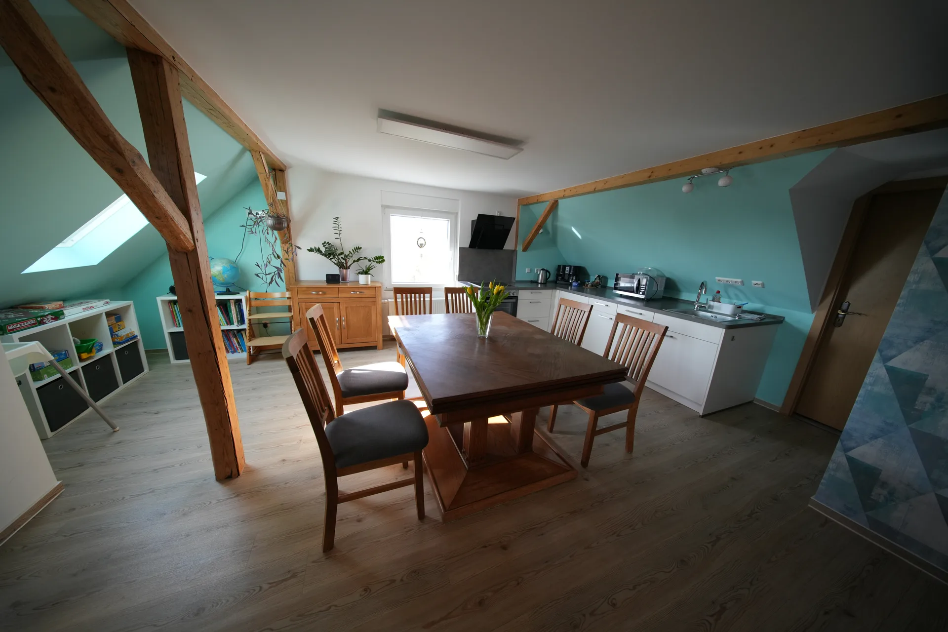 Schöne Aussicht – Open-plan kitchen-living room with dining area and play corner