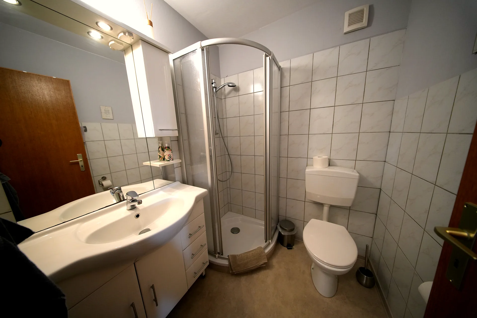 Private bathroom with round shower